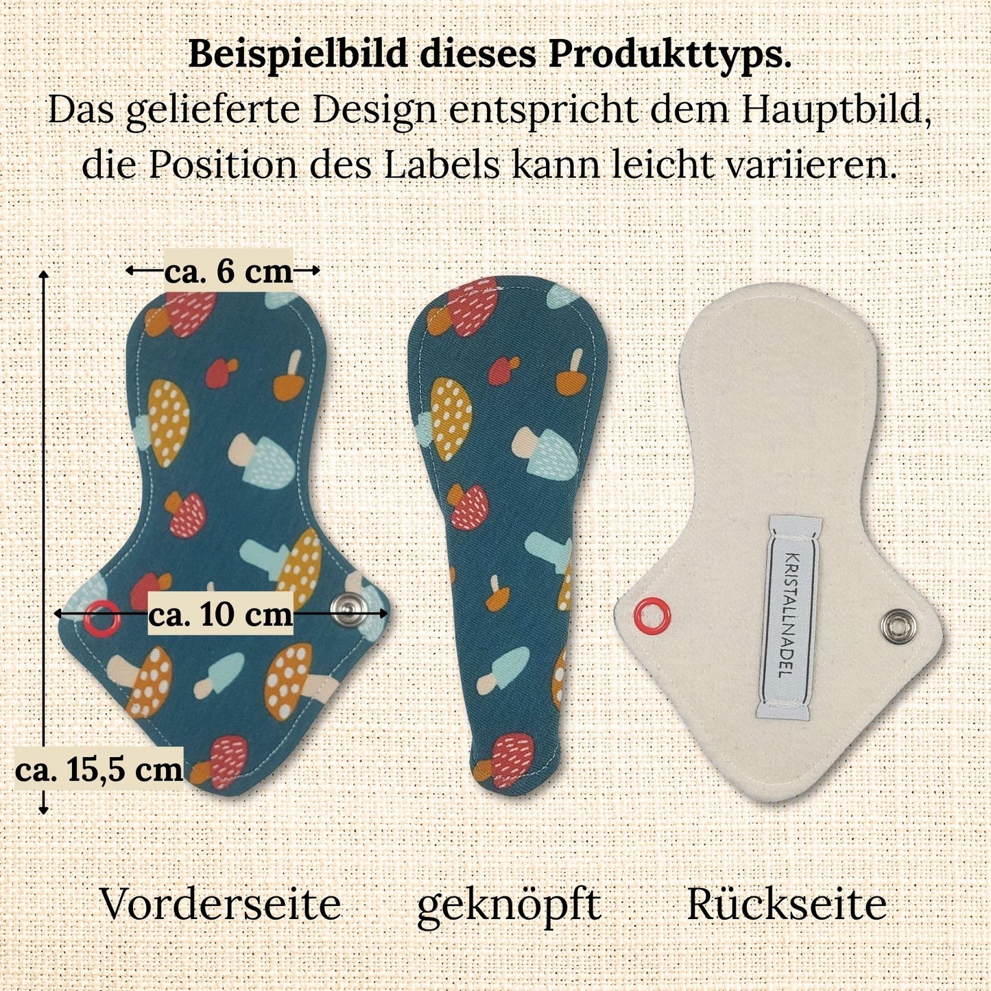 Beispielbild einer Slipeinlage mit Flügeln für Strings mit Maßangaben: ca. 15,5 cm Länge und 10 cm Breite im geöffneten Zustand. Vorderseite mit buntem Jersey, Rückseite aus naturfarbenem Bio-Molton mit Label.